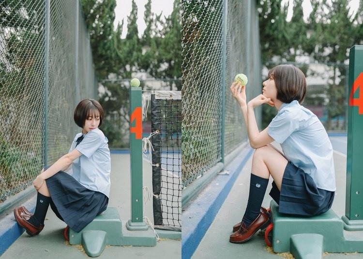 短發少女清純甜美戶外球場寫真圖片
