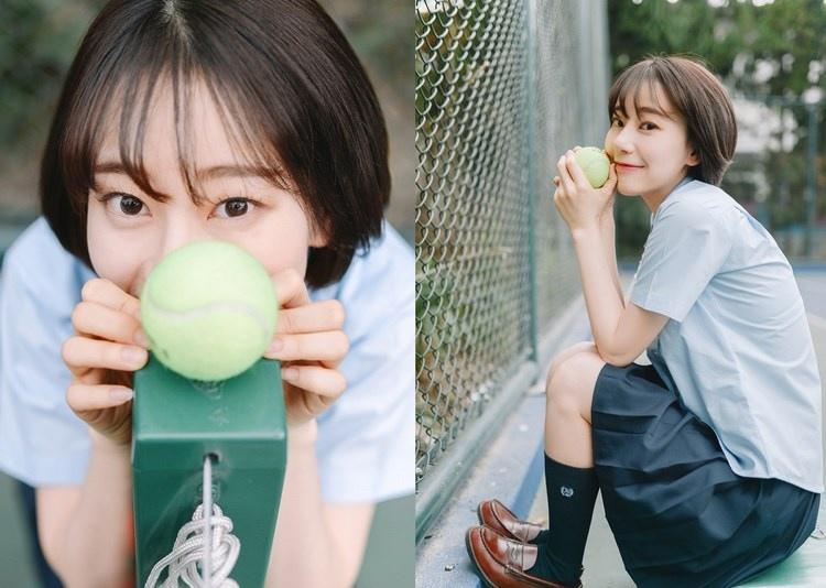 短發少女清純甜美戶外球場寫真圖片